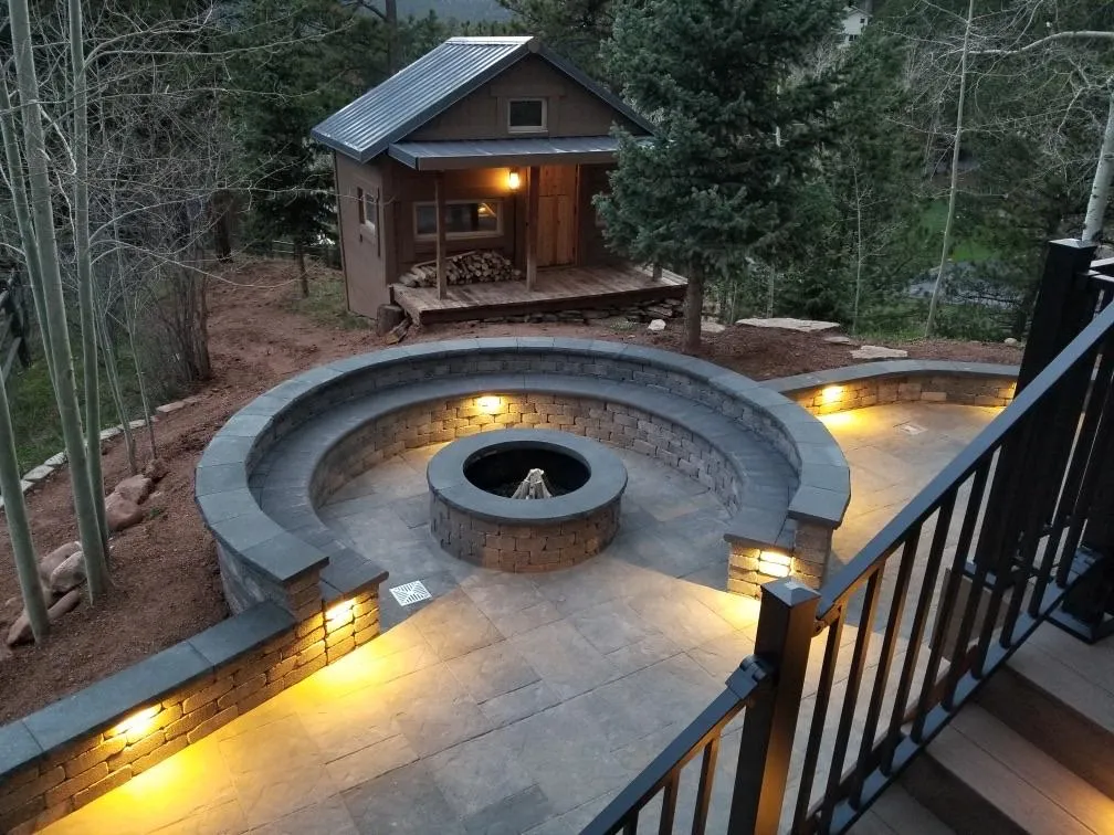 Backyard hardscape fire pit and lighting